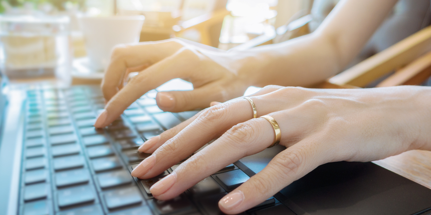 VOSSBot uses specialized VOSS APIs, the Microsoft Bot framework, and artificial intelligence. businesswoman typing on laptop computer