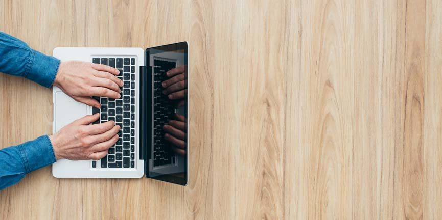 Twilio continues to build the future of communications with its newest offerings: Proxy and Functions. employee typing and coding on laptop computer