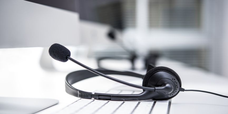 headset on keyboard in a modern contact center