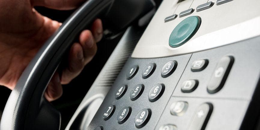 employee using IP desk phone