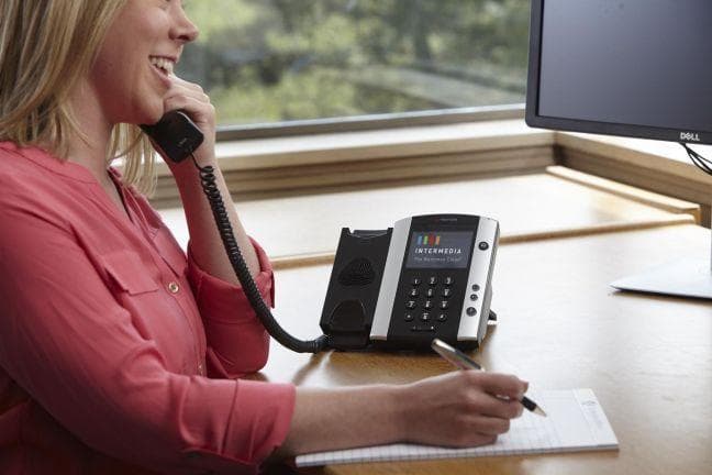 Intermedia shares a number of measures a business can take in order to avoid the consequences associated with communications downtime. employee using Intermedia desk phone