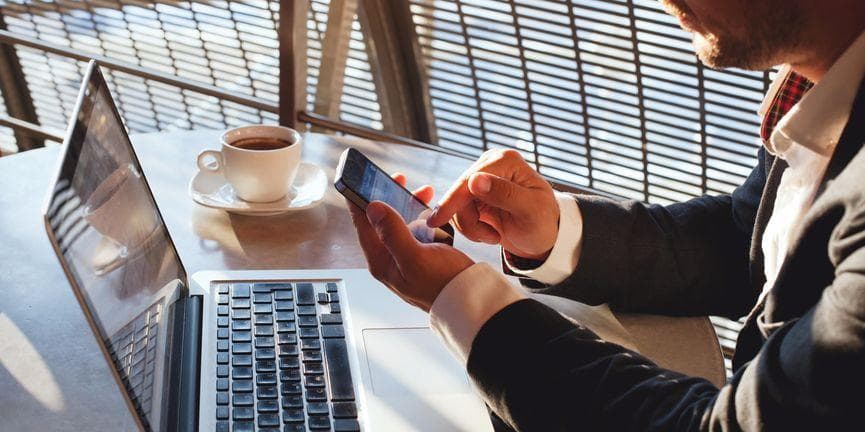 Sameroom lets people connect and collaborate regardless of messaging or collaboration platform. businessman using smartphone messaging