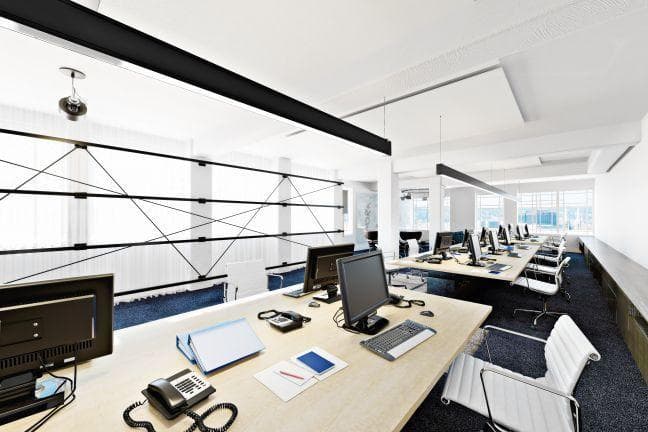 modern office desk phones and computers