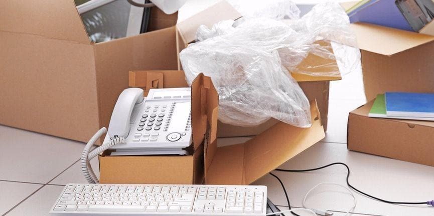 Make office moves a little less stressful with the help of your business VoIP phone system. packing office equipment