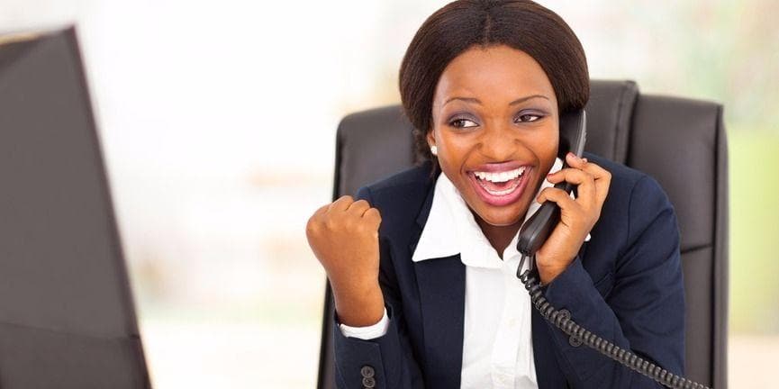 New subscribers to Vonage Business can enjoy the first month of service for free. excited business woman on the phone
