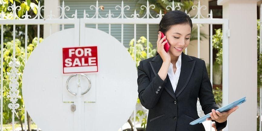real estate agent calling with a smartphone