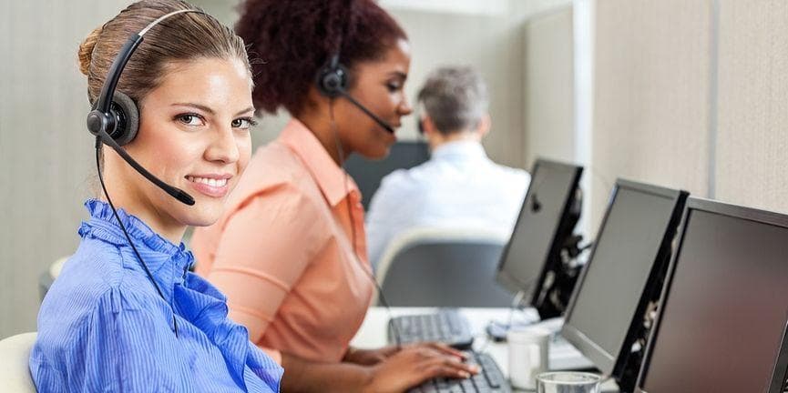 VoIP helps businesses maximize the benefits that outsourcing offers. female employee in a call center