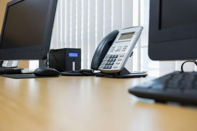 RingCentral wins the Company of the Year award from Frost & Sullivan for their hosted IP telephony solution. ip phone and desktop computer