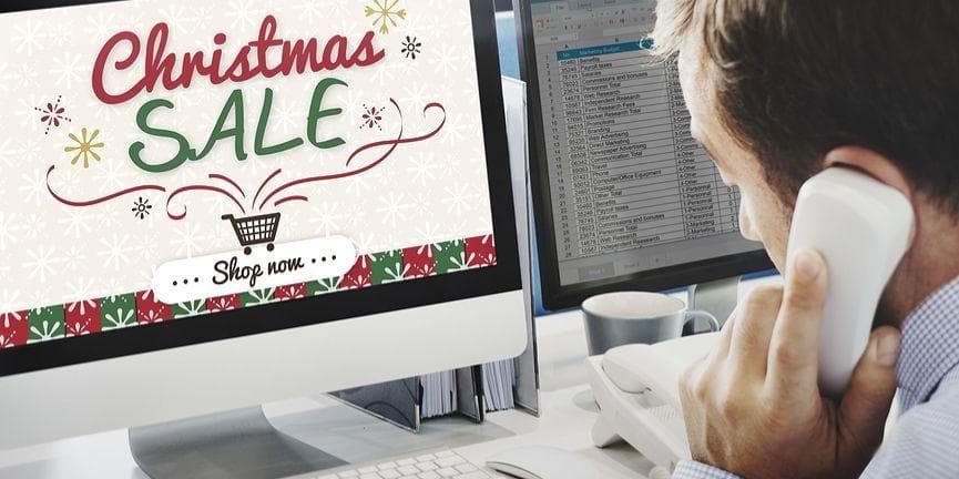 Prepare your business phone for the holiday rush to guarantee a boost in sales and revenue. Christmas sale with employee on the phone