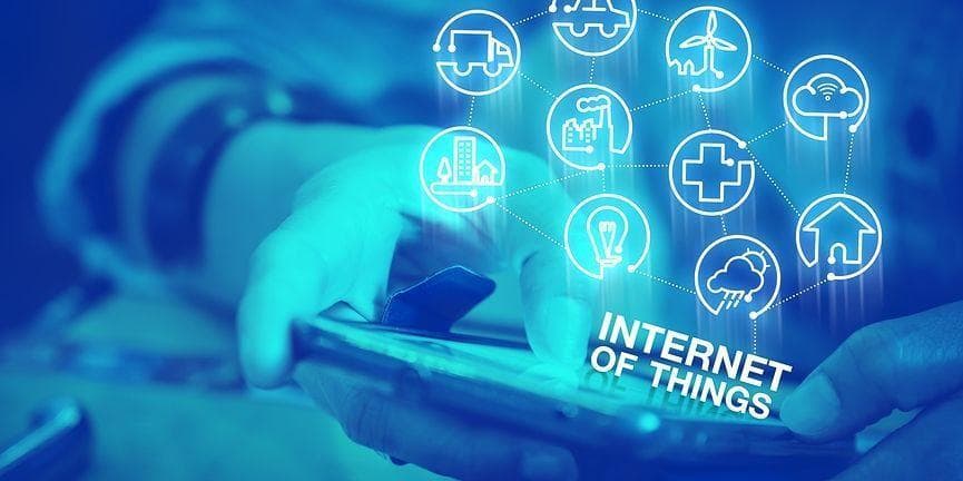 Combining VoIP with IoT is a necessary and logical step for businesses that seek to maximize the advantages of VoIP. employee holding mobile phone with Internet of things