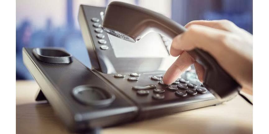 employee using desk IP phone