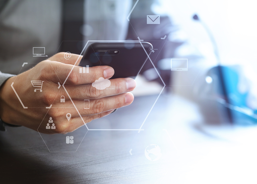 man's hand using mobile voip