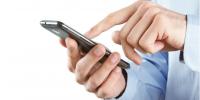 These VoIP calling solutions are great alternatives to Google Voice. businessman holding a mobile phone