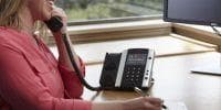 employee using Intermedia desk phone