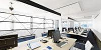 modern office desk phones and computers