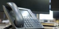 desk ip phone and computer