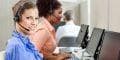 VoIP helps businesses maximize the benefits that outsourcing offers. female employee in a call center