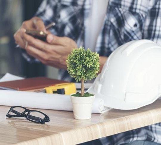 contractor seated and using a mobile device