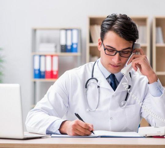 Hospitals can save big on their monthly communication bills by switching to a VoIP service provider. doctor calling patient on the phone
