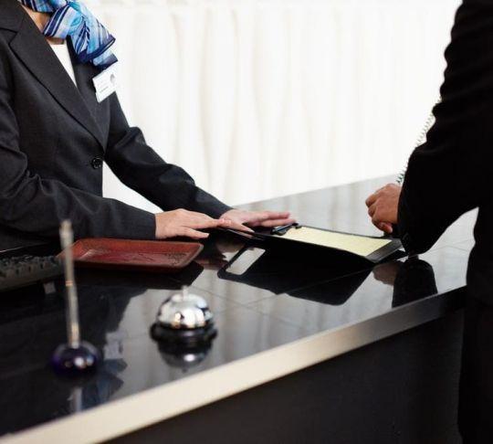 Hotels can easily switch from an outdated POTS system to a fully-featured VoIP phone solution. hotel reception desk