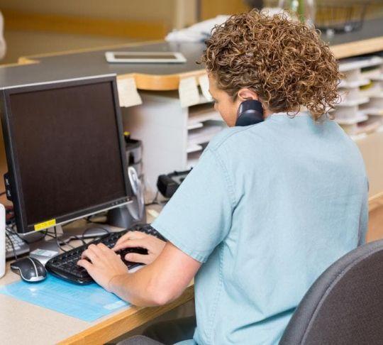 nurse using reception phone