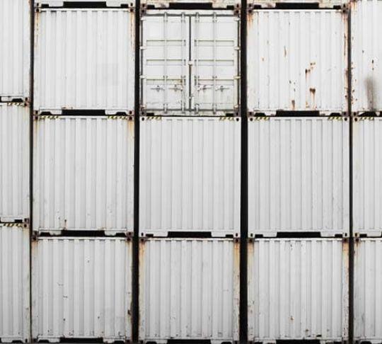 truck shipping containers stacked